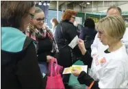  ?? LAUREN HALLIGAN — MEDIANEWS GROUP FILE ?? Samples are handed out at the 10th annual New York Women’s Expo.