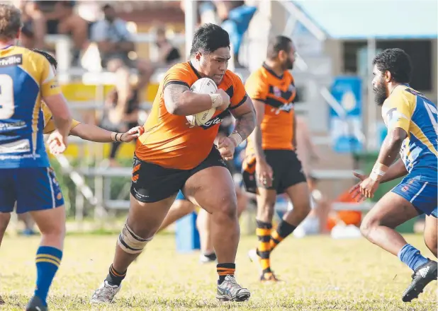  ?? Picture: BRENDAN RADKE ?? BATTERING RAM: Tully forward Jordan Talanoa presents a big problem for the Kangaroos defence at Vico Oval yesterday.