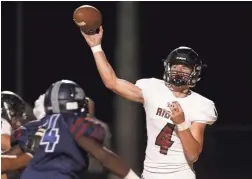  ??  ?? Mountain Ridge's Keegan Stancato (4) throws against Perry during the first half of their game in Gilbert last Nov. 8.