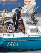  ?? ASSOCIATED PRESS FILE PHOTO ?? Juan Manuel Ballestero stands on his boat June 18 in Mar del Plata, Argentina. Ballestero crossed the Atlantic on his small sailboat to be reunited with his parents after flights to Argentina were halted due to COVID-19.
