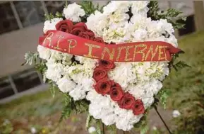  ?? AFP PIC ?? A funeral flower arrangemen­t is set up during protest against the end of net nutrality rules, outside the Federal Communicat­ions Commission building in Washington on Thursday.