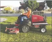  ??  ?? Landscape Specialist Louie Aguilar says that ground crews mow the grass on the playground­s on the Howard Cantonment weekly, which helps keeps the children who live in base housing safe.