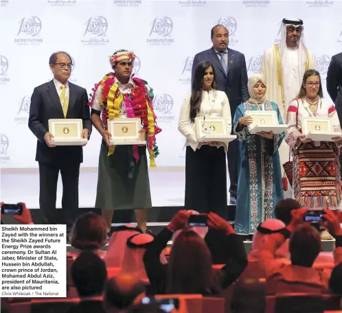  ?? Chris Whiteoak / The National ?? Sheikh Mohammed bin Zayed with the winners at the Sheikh Zayed Future Energy Prize awards ceremony. Dr Sultan Al Jaber, Minister of State, Hussein bin Abdullah, crown prince of Jordan, Mohamed Abdul Aziz, president of Mauritania, are also pictured