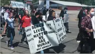  ?? KEVIN MARTIN — THE MORNING JOURNAL ?? Peaceful Protesters march down Oberlin Avenue in Lorain on March 31 in joining the national outrage over the death of African American George Floyd at the hands of a police officer in Minneapoli­s.