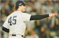  ?? SETH WENIG/AP ?? New York Yankees pitcher Gerrit Cole reacts to a check swing by the Houston Astros during the fourth inning of Game 3 of the ALCS last season.