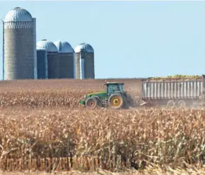  ?? MARK HOFFMAN / MILWAUKEE JOURNAL SENTINEL ?? A load of freshly chopped and harvested corn is taken away from the field on the family farm of Roger Rueth in Loyal on Oct. 10.