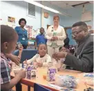  ?? ANNYSA JOHNSON / MILWAUKEE JOURNAL SENTINEL ?? Milwaukee Public Schools Interim Superinten­dent Keith Posley meets with students in a classroom at Benjamin Franklin School.