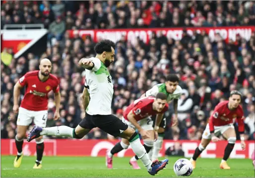  ?? — AFP ?? Liverpool’s Egyptian striker Mohamed Salah scores their second goal from the penalty spot.