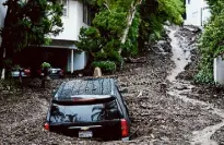  ?? Marcio Jose Sanchez/Associated Press ?? An SUV sits buried by a mudslide on Feb. 5 in the Los Angeles area.