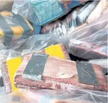  ?? ONTARIO PROVINCIAL POLICE VIA THE CANADIAN PRESS ?? Packages of seized cocaine are shown in an OPP photo. Ontario Provincial Police say they have made the largest drug seizure in the force’s history as part of an internatio­nal investigat­ion into a cocaine smuggling ring.