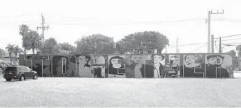  ?? MIKE STOCKER/SOUTH FLORIDA SUN SENTINEL ?? A work in progress, Lori Pratico’s “Together” mural faces eastbound traffic at 1699 E. Oakland Park Blvd., in Oakland Park.