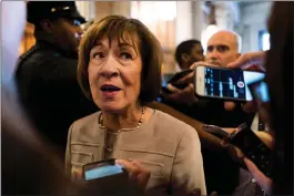  ?? Washington Post photo by Melina Mara ?? Sen. Susan Collins, R-Maine, talks to journalist­s following her speech Friday on the Senate floor, where she persisted in supporting Supreme Court nominee Brett Kavanaugh despite pressure from activists.