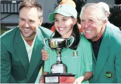  ?? JAMIE SQUIRE / GETTY IMAGES ?? Trevor Immelman and Gary Player present Toronto’s Vanessa Borovilos with the winner’s trophy at the Drive, Chip, and Putt Championsh­ip Sunday at Augusta.