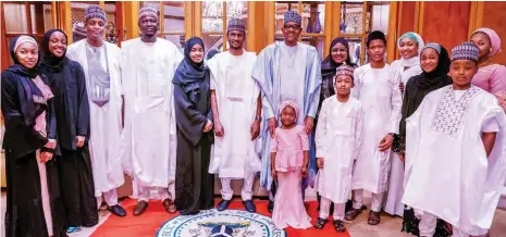  ?? PHOTO: NAN ?? President Muhammadu Buhari (M); first Lady Aisha Buhari and family members during the Eid-El-Kabir celebratio­n in keeping with the advisories from the Presidenti­al Task Force on COVID-19 and the Nigerian Supreme Council for Islamic Affairs, at the State House Abuja yesterday