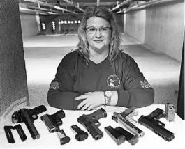  ?? CHARLES REX ARBOGAST/AP ?? Kat Ellsworth, who heads the Liberal Gun Owners club in Illinois, says she is appalled by those who have converged on protests and are openly carrying firearms.