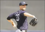  ?? Frank Franklin II / Associated Press ?? J.A. Happ of the Yankees warms up during a game against the Rays in February.