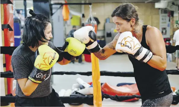  ?? LARRY WONG ?? Sheena Kaine, right, trains with daughter Alexis Flamand at Alliance Boxing Club. “She’s my mom, she’s my best friend,” says Flamand.