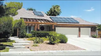  ?? STAN HANEL/RJREALESTA­TE.VEGAS ?? Adara Power had recently partnered with Bombard Renewable Energy to open an office and showcase home in Las Vegas to market its “JuiceBox” battery backup energy system for residentia­l homes at 1385 S. Tenaya Way in Las Vegas.