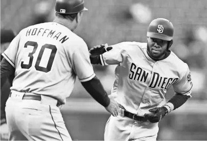  ?? RON CHENOY, USA TODAY SPORTS ?? Padres rookie Manuel Margot, right, batted .269 with three home runs, six RBI and a .828 onbase-plus-slugging percentage in his first 13 games this season.