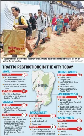  ?? KALPAK PATHAK/HT ?? Election officials collect voting stationery and EVMS at a distributi­on centre in Dadar on the eve of polling day on Tuesday.