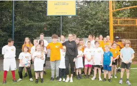  ?? ?? Kelly Smith with youngsters at the event at Queensmead House School. Images from Johan Cruyff Foundation/Ione Saizar