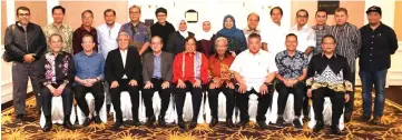  ??  ?? Abang Johari, flanked by Uggah (seated, fourth left) and Masing, joins Awang Tengah (seated, third left), other members of the Sarawak cabinet and GPS MPs in a group photo.