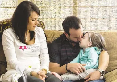  ?? CHERYL EVANS/THE REPUBLIC ?? Reesa Stutzman, 2, suffers from Krabbe disease, an often-fatal degenerati­ve nervous-system disorder. Many states test newborns for the disease, but Arizona doesn’t. Reesa’s parents, Jamie and Sean, hope to change that.