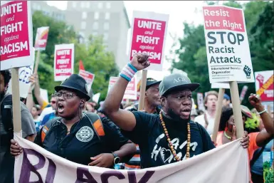  ?? ZACH GIBSON / AGENCE FRANCE-PRESSE ?? A white nationalis­t rally in Washington drew only two dozen demonstrat­ors but thousands of chanting counterpro­testers on Sunday, the one-year anniversar­y of racially charged violence in Charlottes­ville, Virginia.