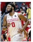  ?? DAVID JABLONSKI / STAFF ?? Dayton’s Josh Cunningham reacts after a victory against Georgia State on Saturday at UD Arena.