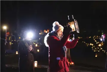  ?? PHOTOS BY PETER MORRISON — THE ASSOCIATED PRESS ?? People participat­e in a candleligh­t pilgrimage which makes its way past an ancient well associated with St. Brigid to the Solas Bhride Center in Kildare, Ireland, on Tuesday.