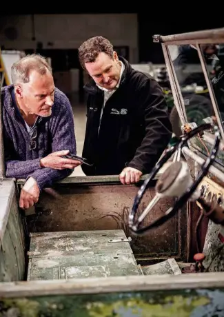  ??  ?? Below and facing page
Octane’s Mark Dixon talks pre-production Land Rovers with JLR’s Mike Bishop; 9/48 date stamp on radiator could indicate when this vehicle was converted to right-hand drive.