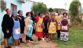  ?? ?? The community members who came together to cook at the Ayanda Nela’s funeral.