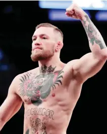  ??  ?? Conor McGregor gestures toward fans while working out at Madison Square Garden in New York in this November 2016 file photo. (AP)