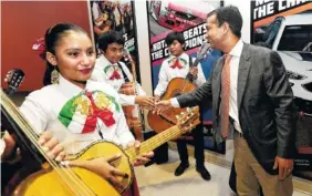  ?? AP PHOTO BY LYNNE SLADKY ?? U.S. Rep. Carlos Curbelo, R-Fla., shakes hands with band members while attending the 34th annual Farmworker Student Recognitio­n Ceremony in Homestead, Fla.