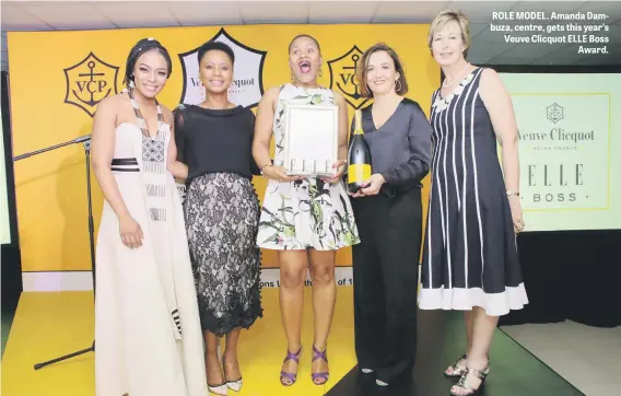  ??  ?? ROLE MODEL. Amanda Dambuza, centre, gets this year’s Veuve Clicquot ELLE Boss Award.