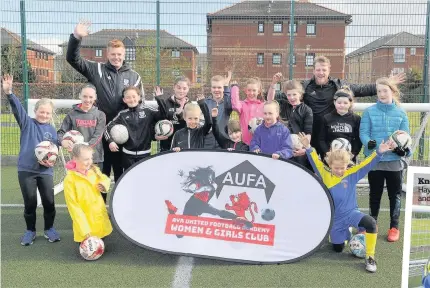  ??  ?? Making waves Coaches Ross Armour and Jason Butler with some of the girls