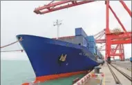  ?? WU MAOHUI / XINHUA ?? A container vessel leaves Yangpu Port, Hainan province, for Vietnam.