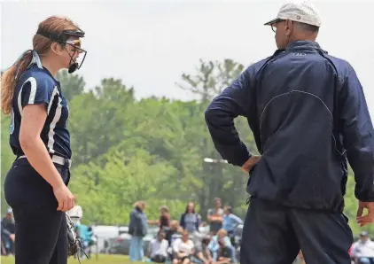  ?? BRANDON BROWN ?? York High School softball coach Kevin Giannino and McKayla Kortes share a quick chat during a Class B South game last season. The Wildcats beat Nokomis in the state championsh­ip game last June at Brewer High School.