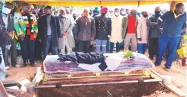  ?? ?? Liberation Heroine Cde Mabhena is laid to rest at Malalume Village in Bulilima district yesterday. Hon Dingumuzi Phuti (second from left), was among the mourners