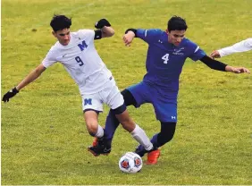  ?? GREG SORBER/JOURNAL ?? Berkeley Reynolds (9) of St. Michael’s and Bosque School’s Noah Shaulis cross feet and go tumbling while chasing possession in 1A-3A boys quarterfin­al action.