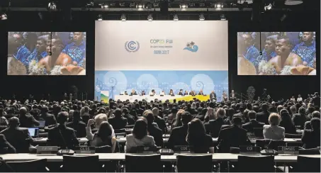  ?? Martin Meissner / Associated Press ?? Native people from Fiji sit in the convention center at the opening of the U.N. Climate Change conference in Bonn, Germany.