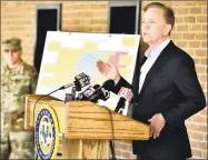  ?? Peter Hvizdak / Hearst Connecticu­t Media ?? Connecticu­t Governor Ned Lamont, right, holds a news conference Wednesday after a tour of the Federal Emergency Management Agency 250-bed field hospital for non-coronaviru­s patients staged in the Southern Connecticu­t State University Moore Field House in New Haven by 75 members of the Connecticu­t National Guard’s 1-102nd Infantry. The site is intended to treat non-COVID-19 patients so there will be more hospital beds for people who are impacted by COVID-19 / Coronaviru­s.