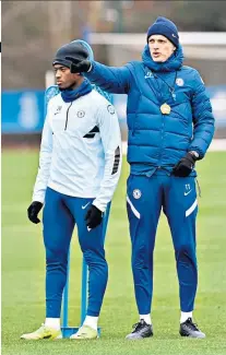  ??  ?? Tough love: Callum Hudson-odoi listens to Thomas Tuchel (right) as he directs a training session