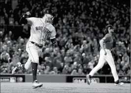  ?? ASSOCIATED PRESS ?? HOUSTON ASTROS’ CARLOS CORREA celebrates after his RBI-single against the Boston Red Sox during the sixth inning in Game 1 of the ALCS on Saturday in Boston.