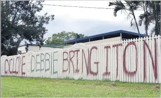  ?? Picture: AAP. ?? A painted message directed at Cyclone Debbie on the front fence of a house in Bowen. Story page 15.
