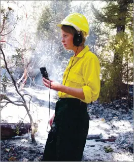  ?? PHOTO CONTRIBUTE­D ?? Emily Ellickson-brown delivering a remote update on the North Pass Fire in 2012 for KYBU.