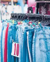 ?? DREAMSTIME ?? Head for the pants racks first when shopping at a thrift store, says Answer Angel Ellen Warren.