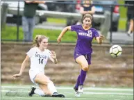  ?? Matthew Brown / Hearst Connecticu­t Media ?? Wilton’s Ally Dejana, left, pushes the ball past Westhill’s Emma Whaley in Thursday’s game.