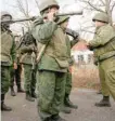  ?? — Reuters ?? Servicemen of the self-proclaimed Donetsk People’s Republic get ready to board a truck near the settlement of Petrovskoy­e (Petrivske) in Donetsk region on Saturday.