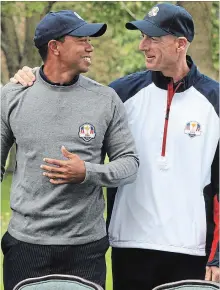  ?? CHICAGO TRIBUNE FILE PHOTO ?? Tiger Woods, left, and Jim Furyk are pictured Sept. 25, 2012, in Medinah, Ill. The Unites States team posed for a photo before the first day of practice at the 39th Ryder Cup at Medinah Country Club.